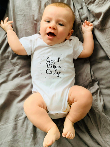 Yoga baby, organic cotton girl boy, good vibes only onesies for babies. Certified organic cotton baby onesie. Baby yoga bodysuit ethically made soft cotton. No latex, skin-friendly. Toddler skin healthy. non-toxic, eco-friendly yoga onesies for babies made with minimal wastage. Good vibe romper, babies enjoy yoga. Comfy. Made to last. Gift for babies. Unisex gender-neutral bodysuit, baby shower gift. Unisex onesie 3, 6, 12 months yoga onesies. White bodies baby clothes. one piece